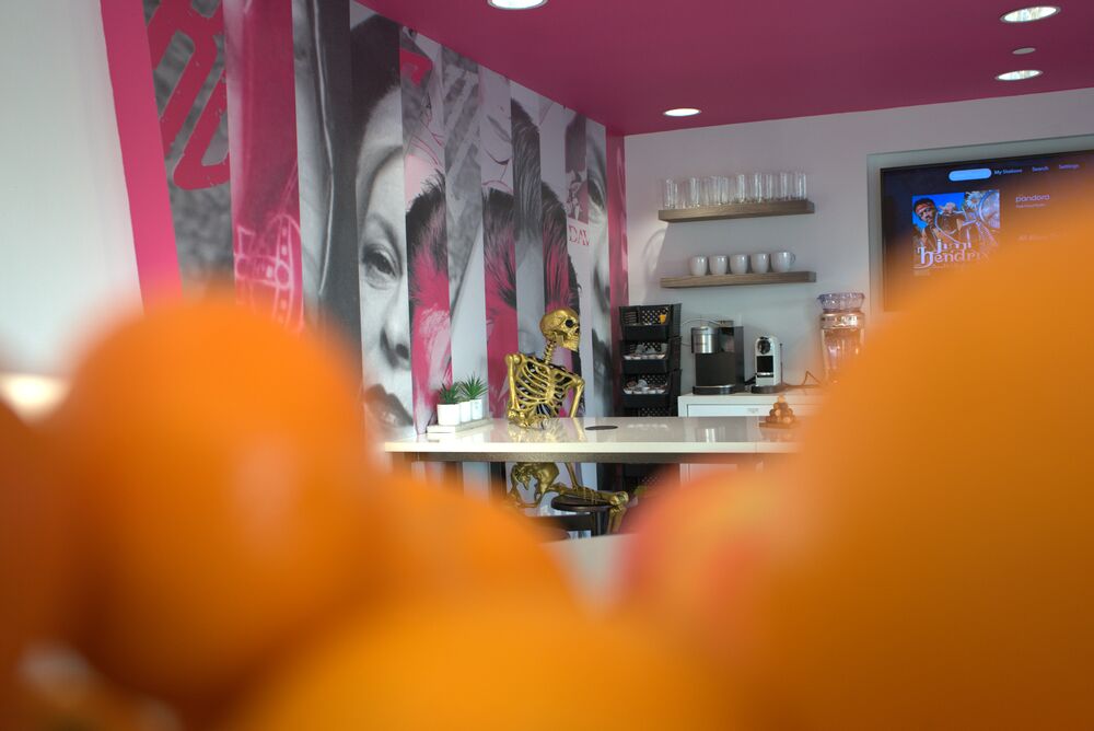 The office café bar, a golden skeleton seated on a stool